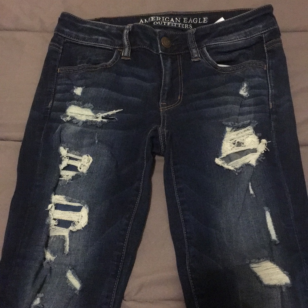 Distressed, dark blue American Eagle jeans